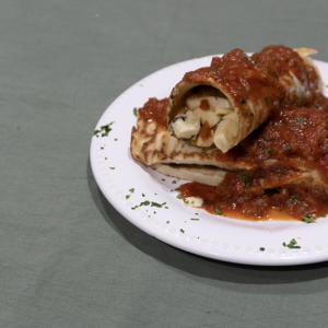 Canelones de ricota y acelga con salsa