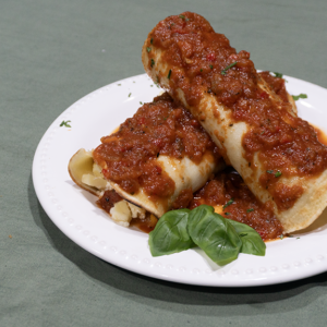 Canelones de calabaza, ricota y muzzarella con salsa fileto