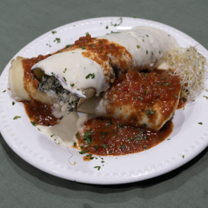 Canelones de ricota, verdura y muzzarella con salsa mixta