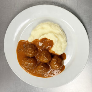 Albóndigas con salsa fileto y puré de papas